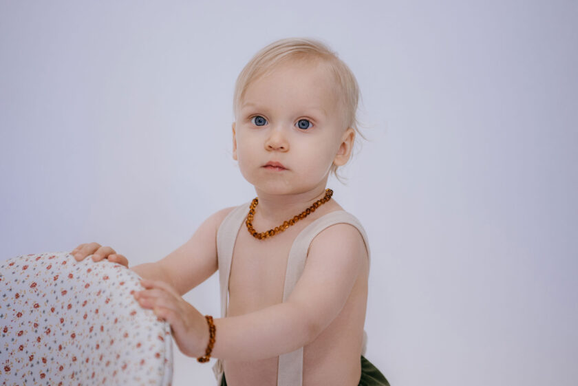 cognac amber teething necklace on baby