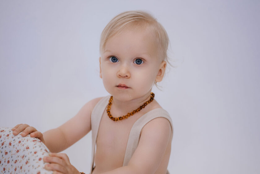classic amber teething necklace on baby