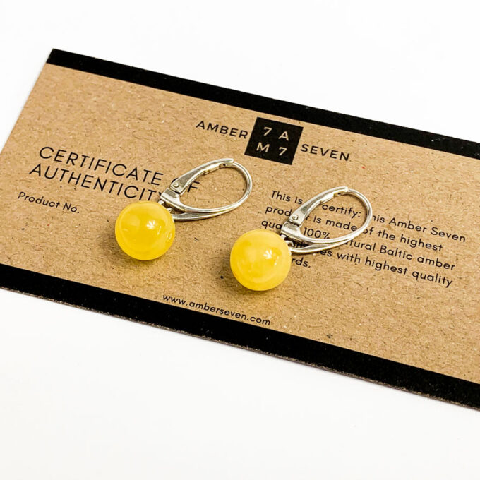 white baltic amber round earrings