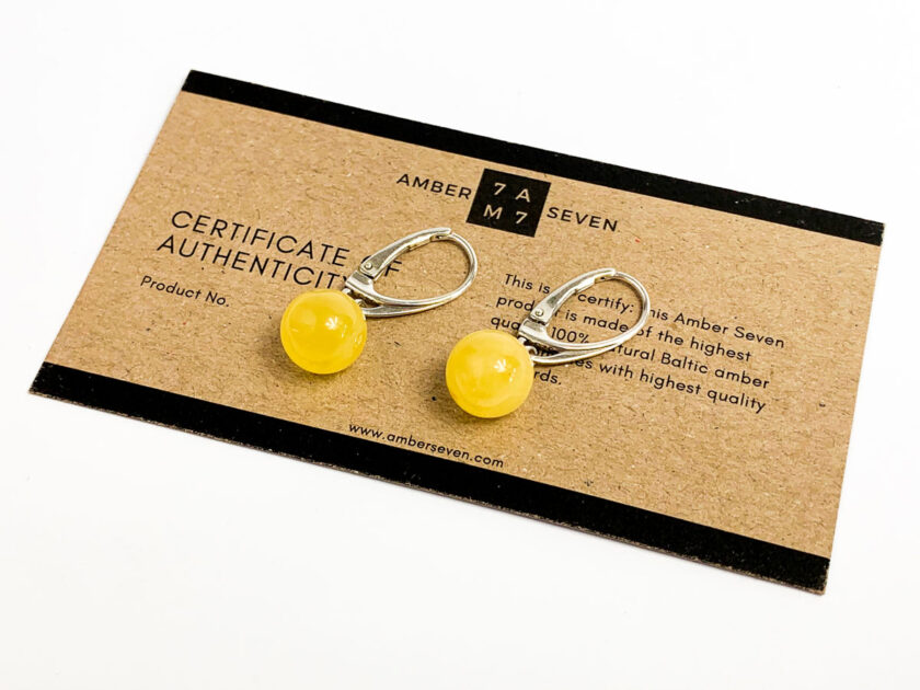 white baltic amber round earrings