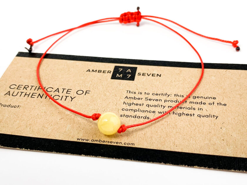 red string bracelet with amber